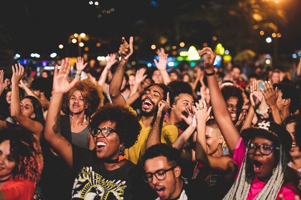 An audience celebrating at a live event
