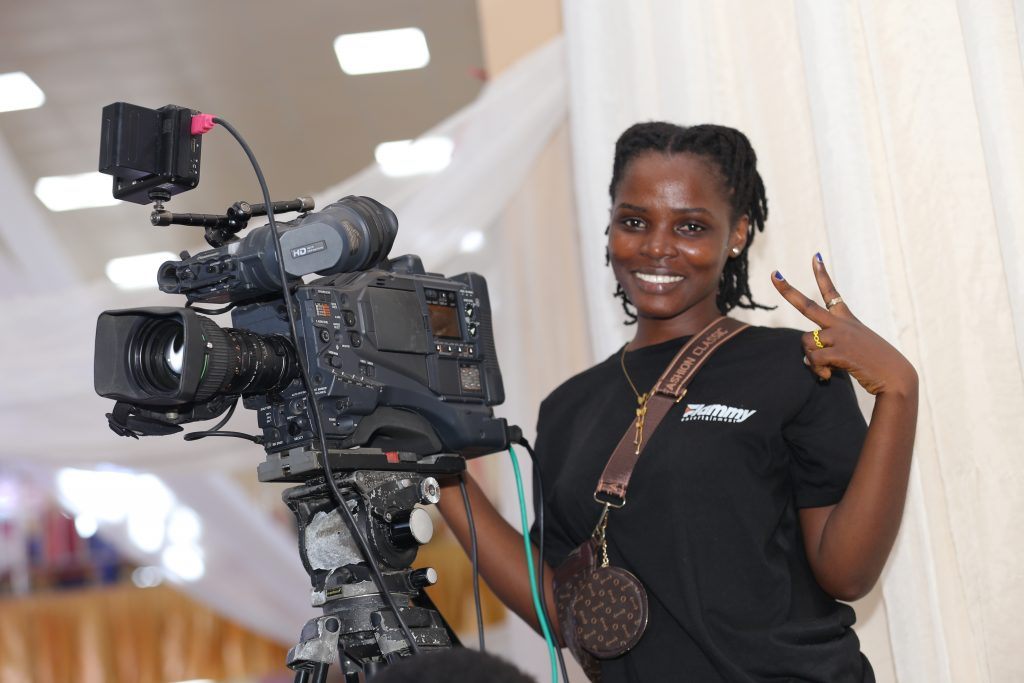 A Flammy crew member with a video camera